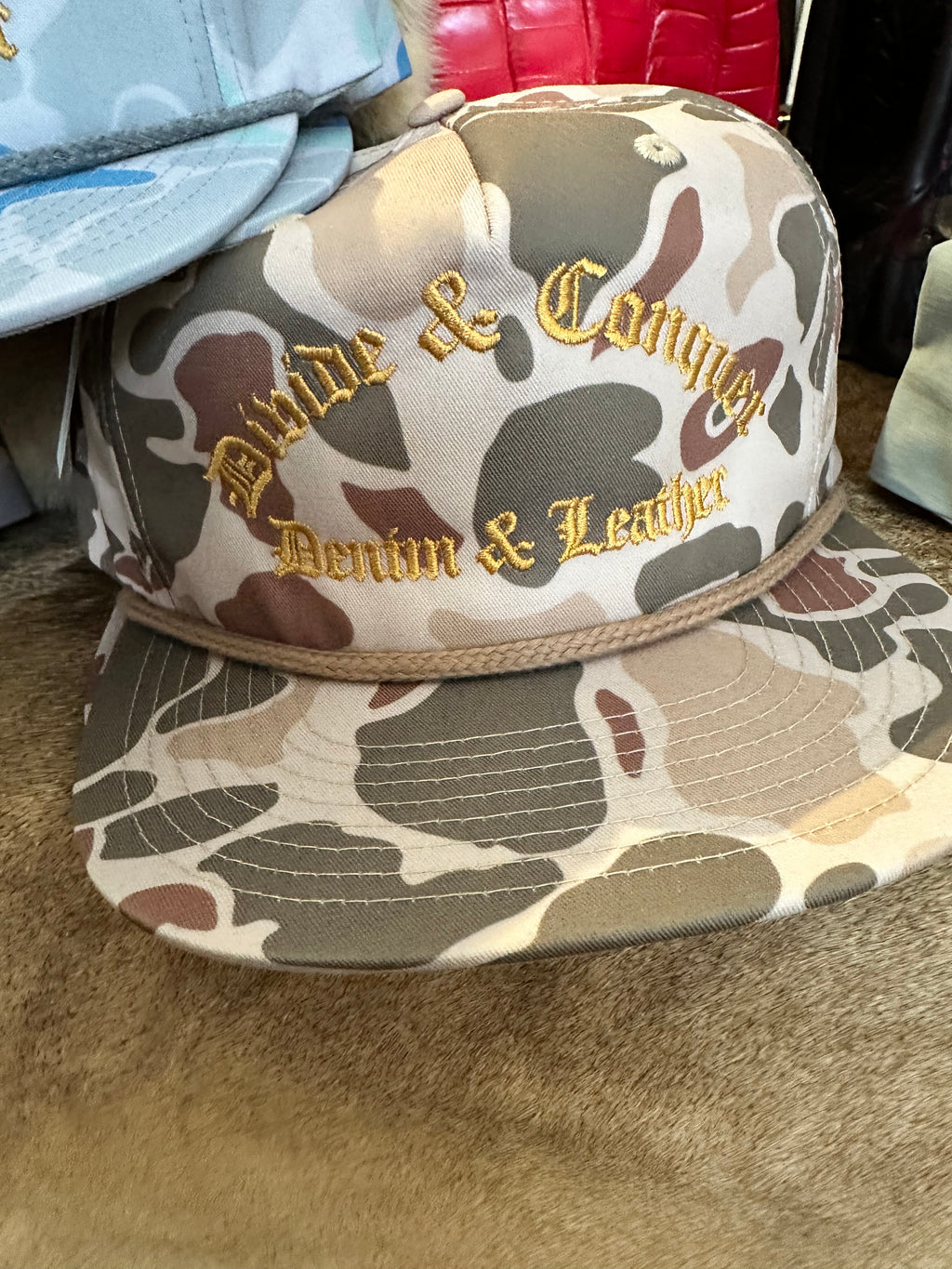 Co. Hat camo with gold text