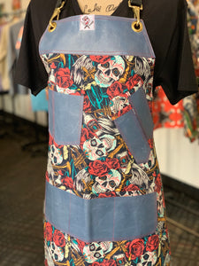 Trumpets and skulls apron