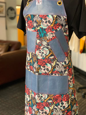 Trumpets and skulls apron
