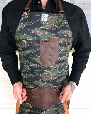 “Survival of the fittest” apron